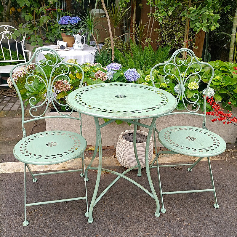 طاولة وكراسي حديدية على الطراز - مراجعة Outdoor Furniture Iron وسعره